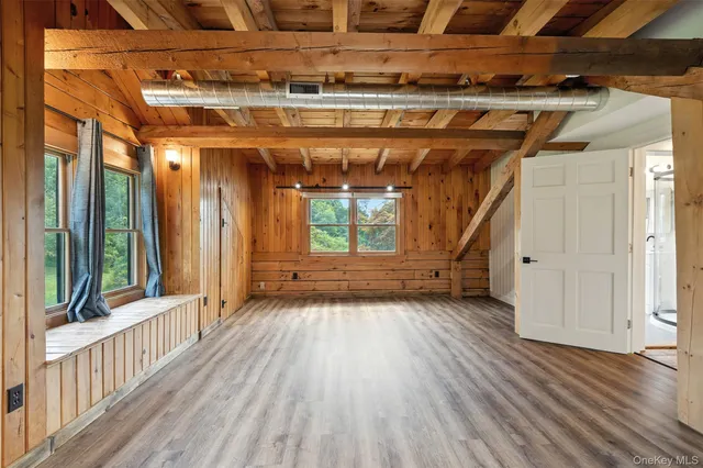 a view of a room with wooden floor and stairs