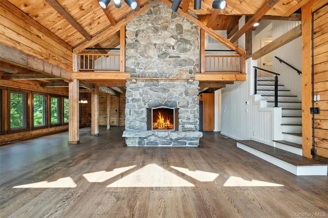 a view of a fireplace with wooden floor and a fireplace
