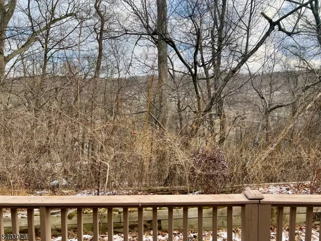 a view of a wooden deck and a trees
