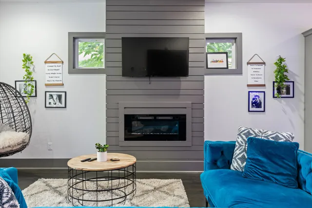 a living room with furniture and a fireplace