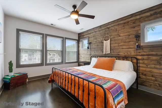 a bedroom with a bed and a window