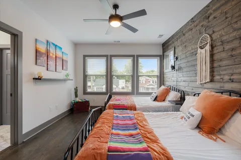 a bedroom with bed and a chandelier
