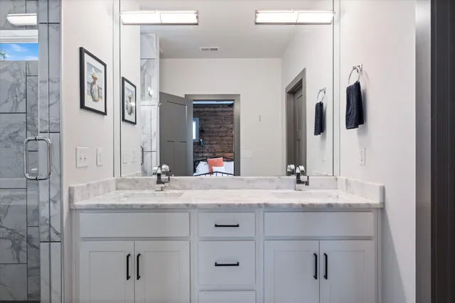 a bathroom with a sink and a mirror