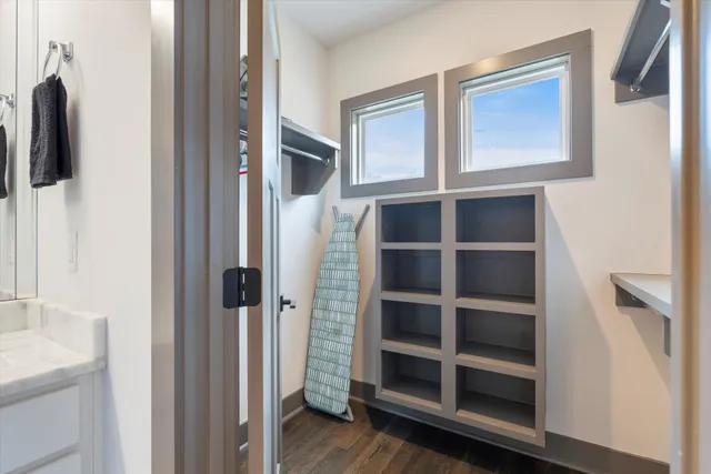 a view of walk in closet with empty racks