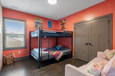 a bedroom with two beds and a window