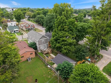 an aerial view of houses with yard