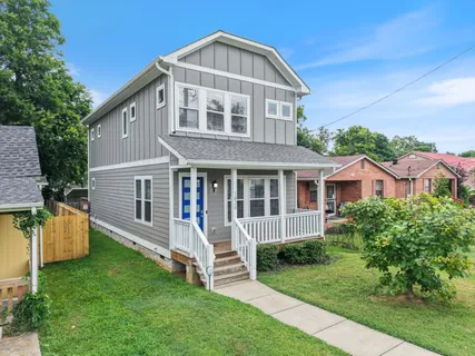 a view of a house with a yard and plants