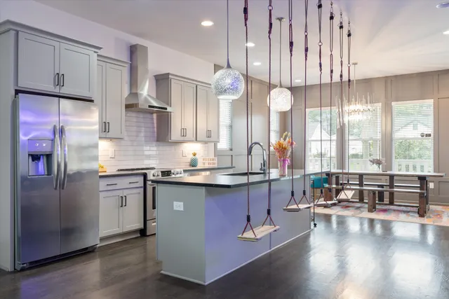 a kitchen with counter top space cabinets and appliances