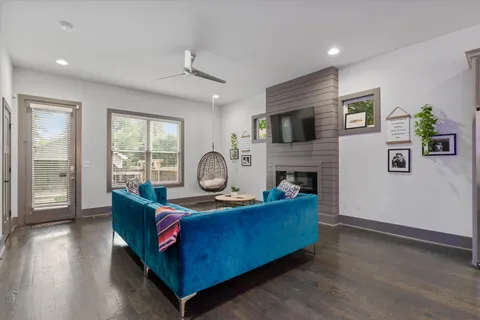 a living room with furniture and a fireplace