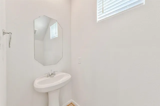 a view of a house with backyard and porch