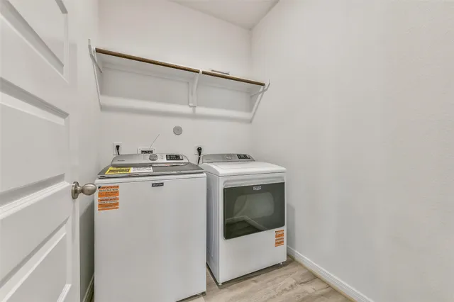 a bathroom with a sink toilet and mirror