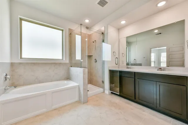 a bathroom with a sink a mirror and vanity