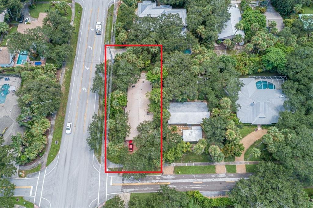 670 Cypress Road Vero Beach, FL 32963 - Photo 18 of 20 an aerial view of residential house with outdoor space and trees all around