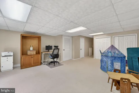 a view of workspace with furniture and a window
