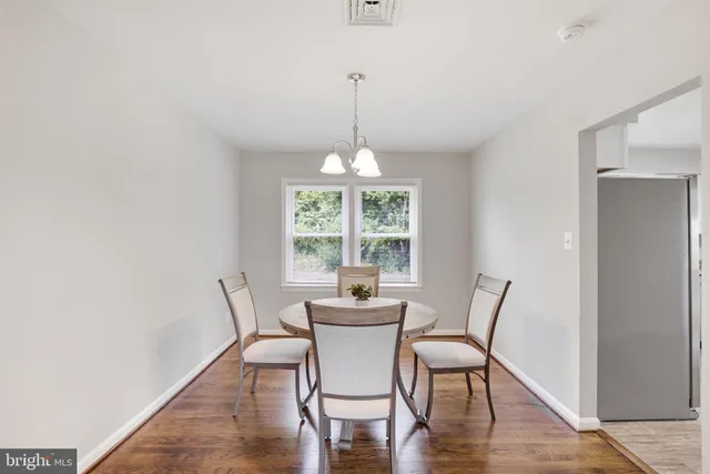 a kitchen with a refrigerator sink and cabinets