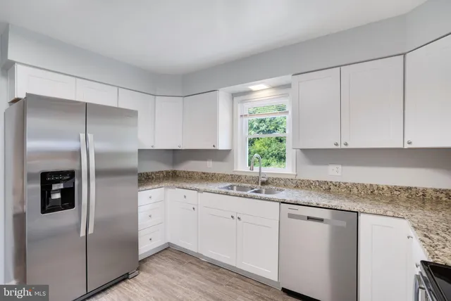 a bedroom with a bed and a ceiling fan
