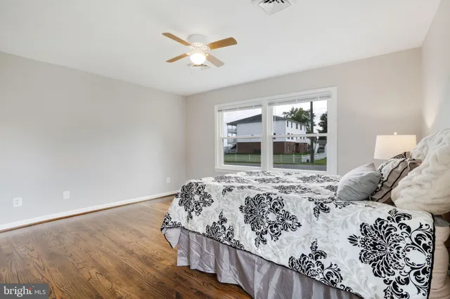 a view of hallway with wooden floor