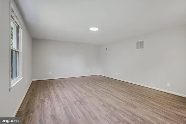 an aerial view of a houses with a street