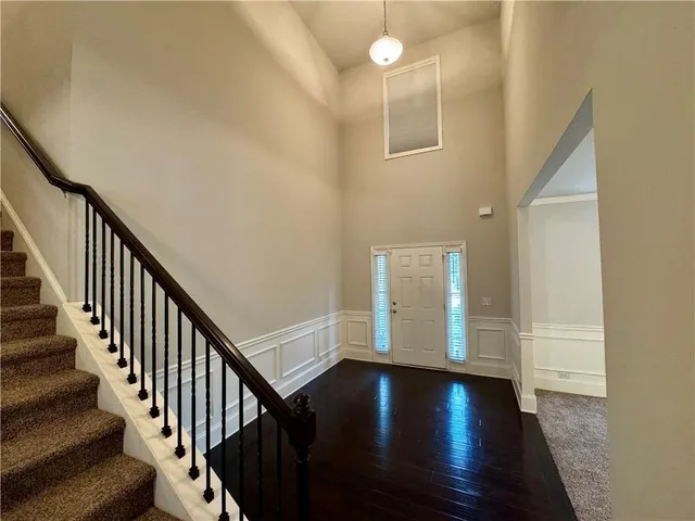 a view of an entryway with wooden floor