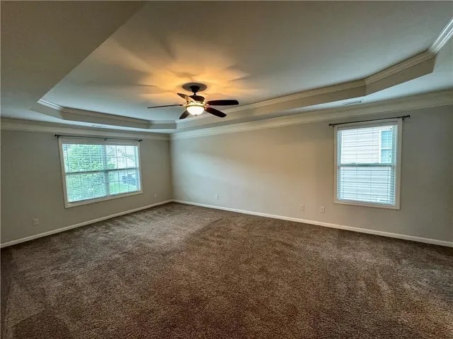 an empty room with a empty space and windows