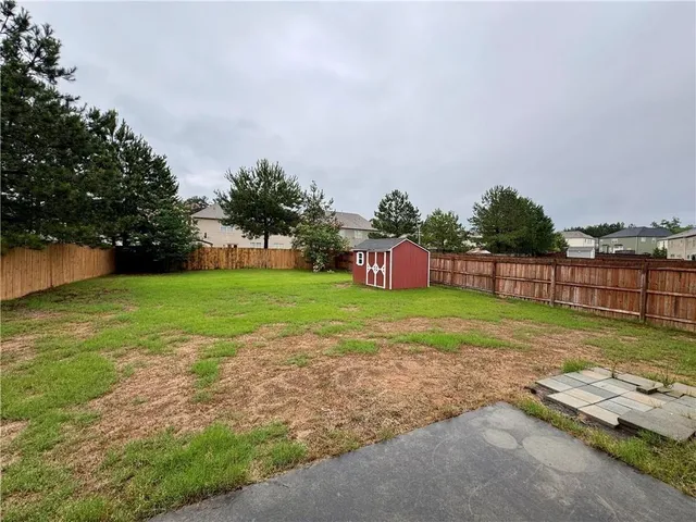 a view of a field with sitting area