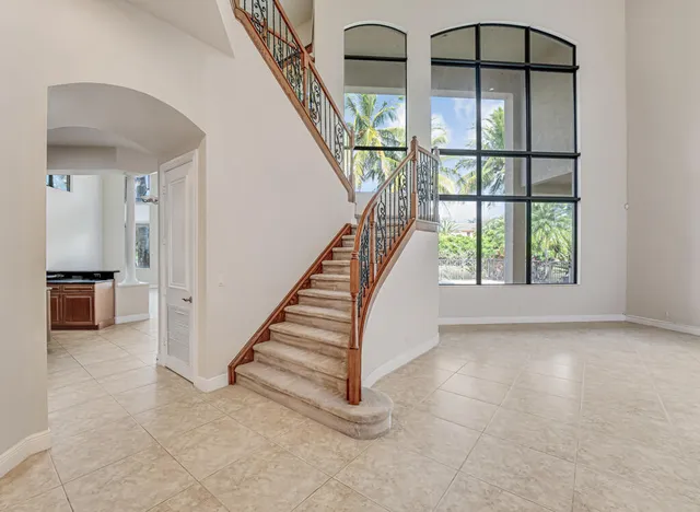 a kitchen with stainless steel appliances granite countertop a sink and a stove