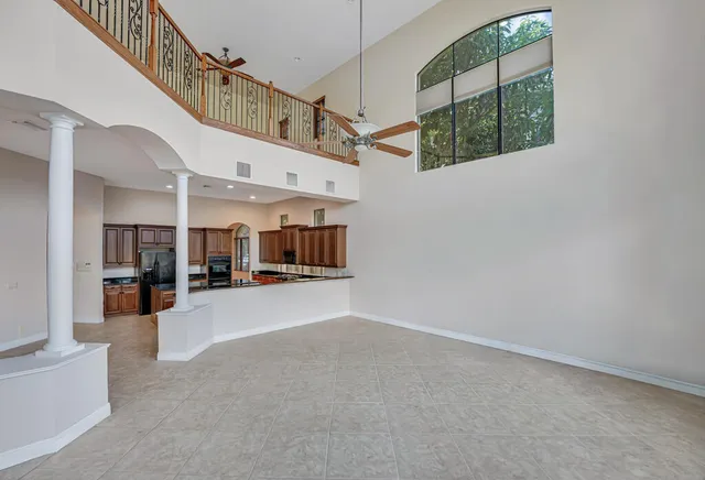 a bathroom with a granite countertop sink toilet and a mirror