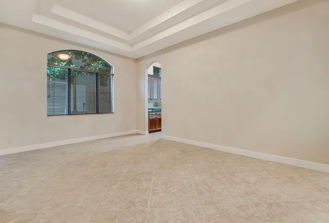 a view of a backyard with a palm tree