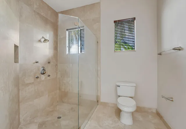 an aerial view of residential houses with outdoor space and river