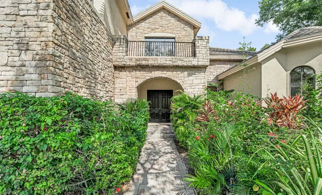 a view of an empty room with windows