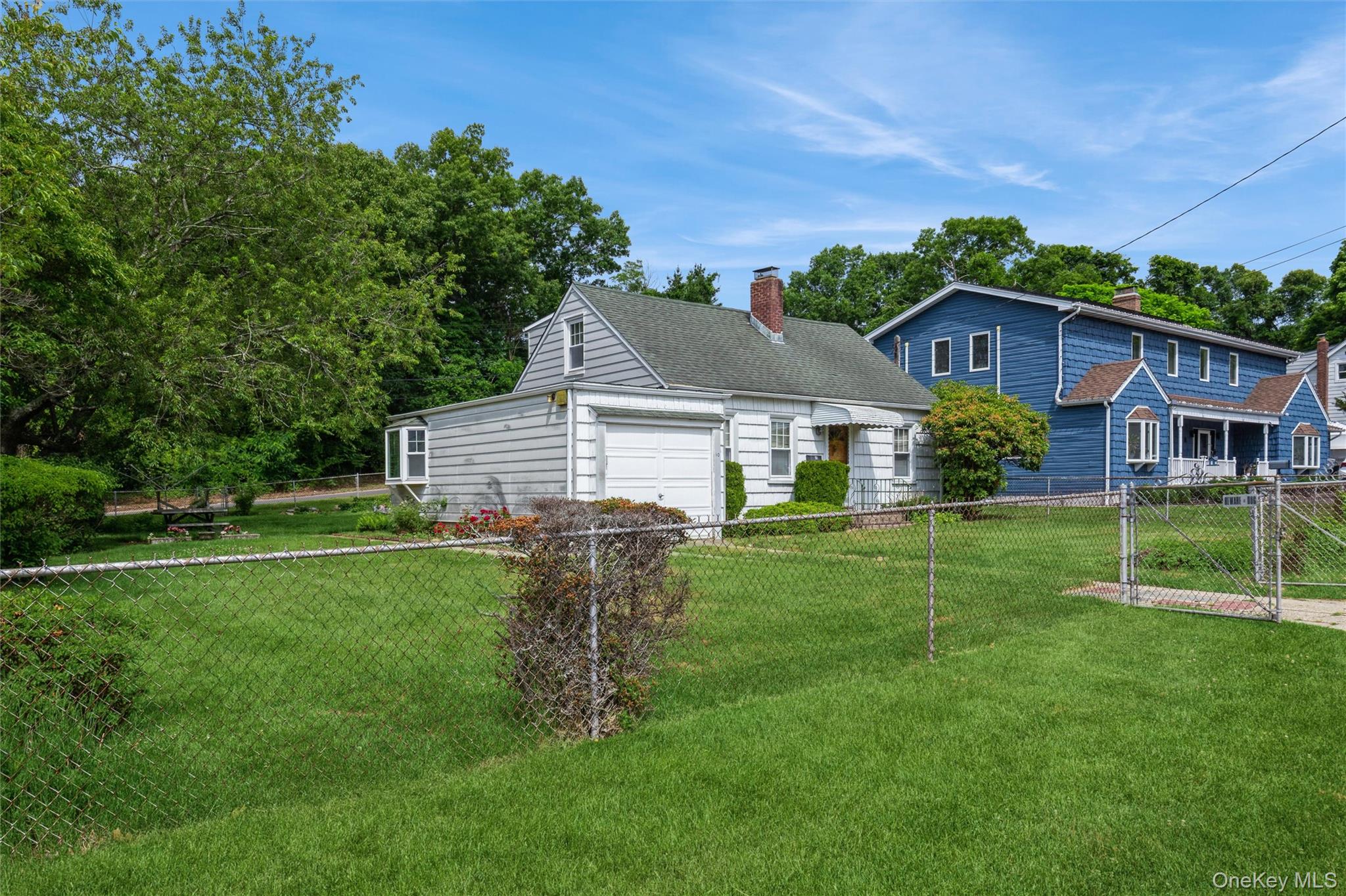 10 Laurel Road Ronkonkoma, NY 11779 - Photo 21 of 21 a aerial view of a house with a yard table and chairs