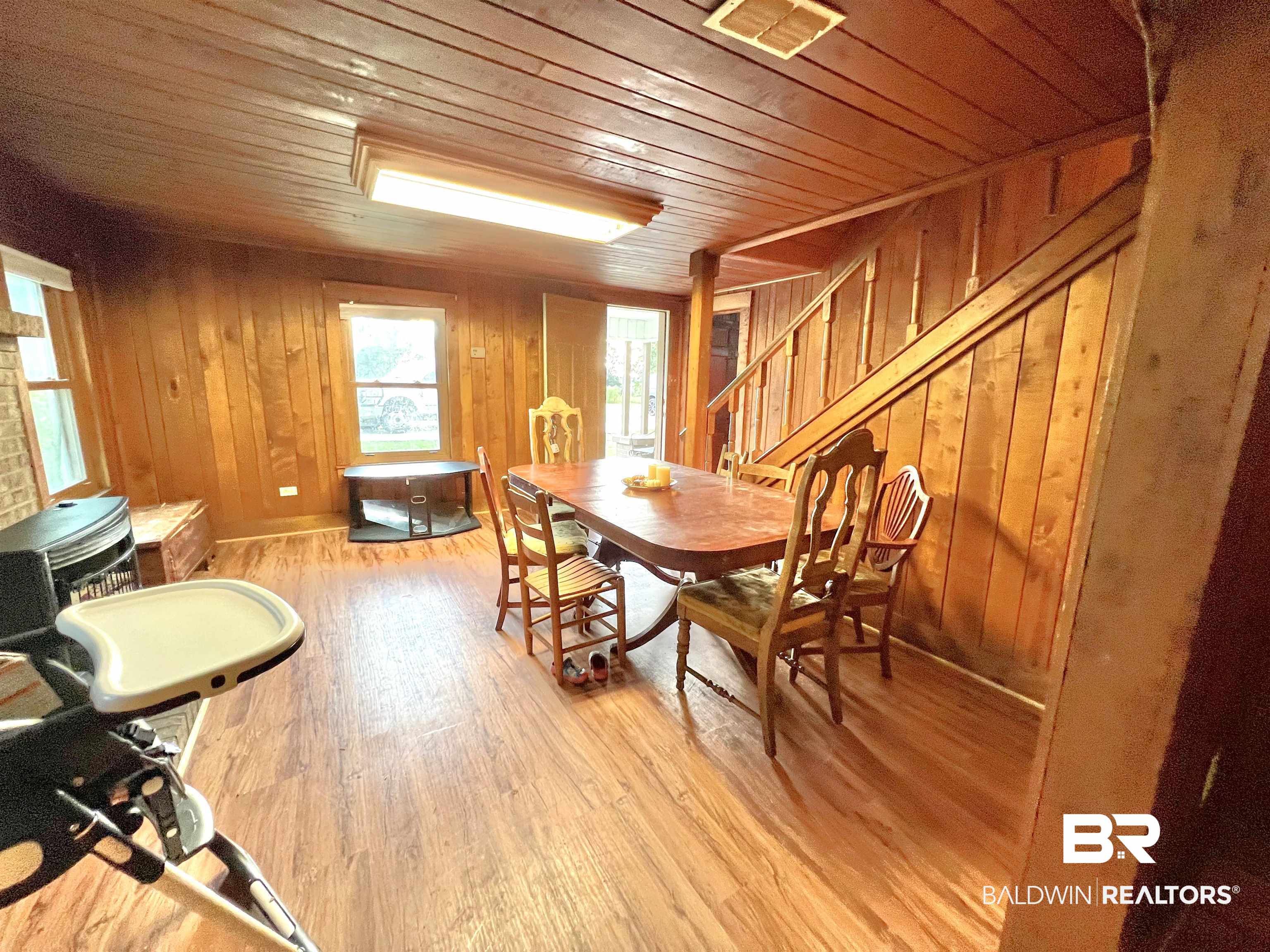 10283 Appleton Road Brewton, AL 36426 - Photo 10 of 18 Dining area featuring wooden ceiling, light wood-type flooring, and wood walls