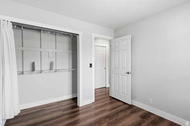 2693 Teal Way Sandy, UT 84093 - Photo 22 of 50 Interior room featuring wood-finish flooring, light gray wall paint, and white trim