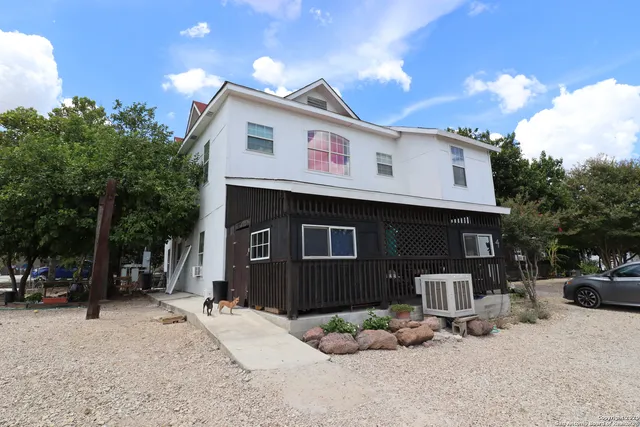 a front view of a house with parking space