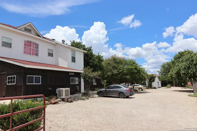 a view of street with parked cars