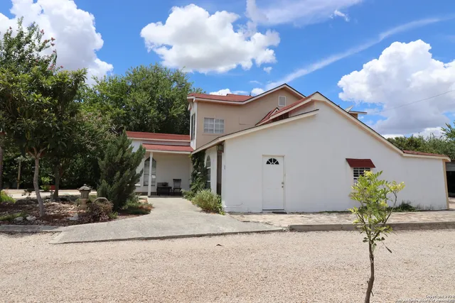 a view of a house with a street