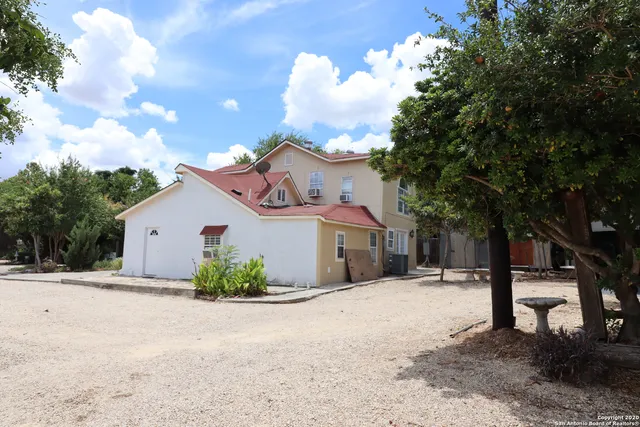 a view of a house with a snow in the yard