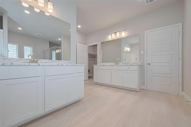 a view of a bathroom with a tub sink and mirror