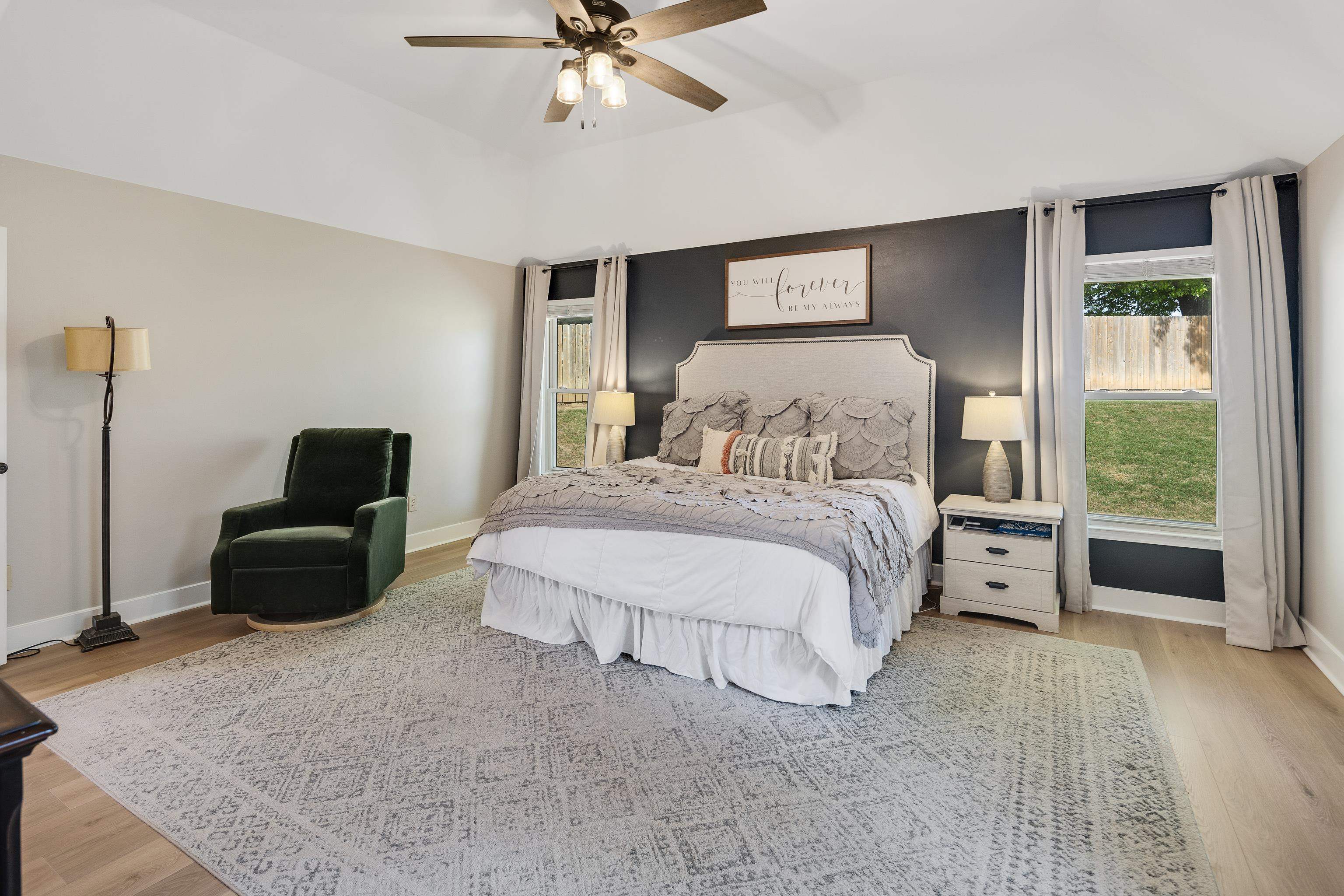 288 Hughes Cove Collierville, TN 38017 - Photo 16 of 31 Bedroom with light wood-style floors, a ceiling fan, and lofted ceiling