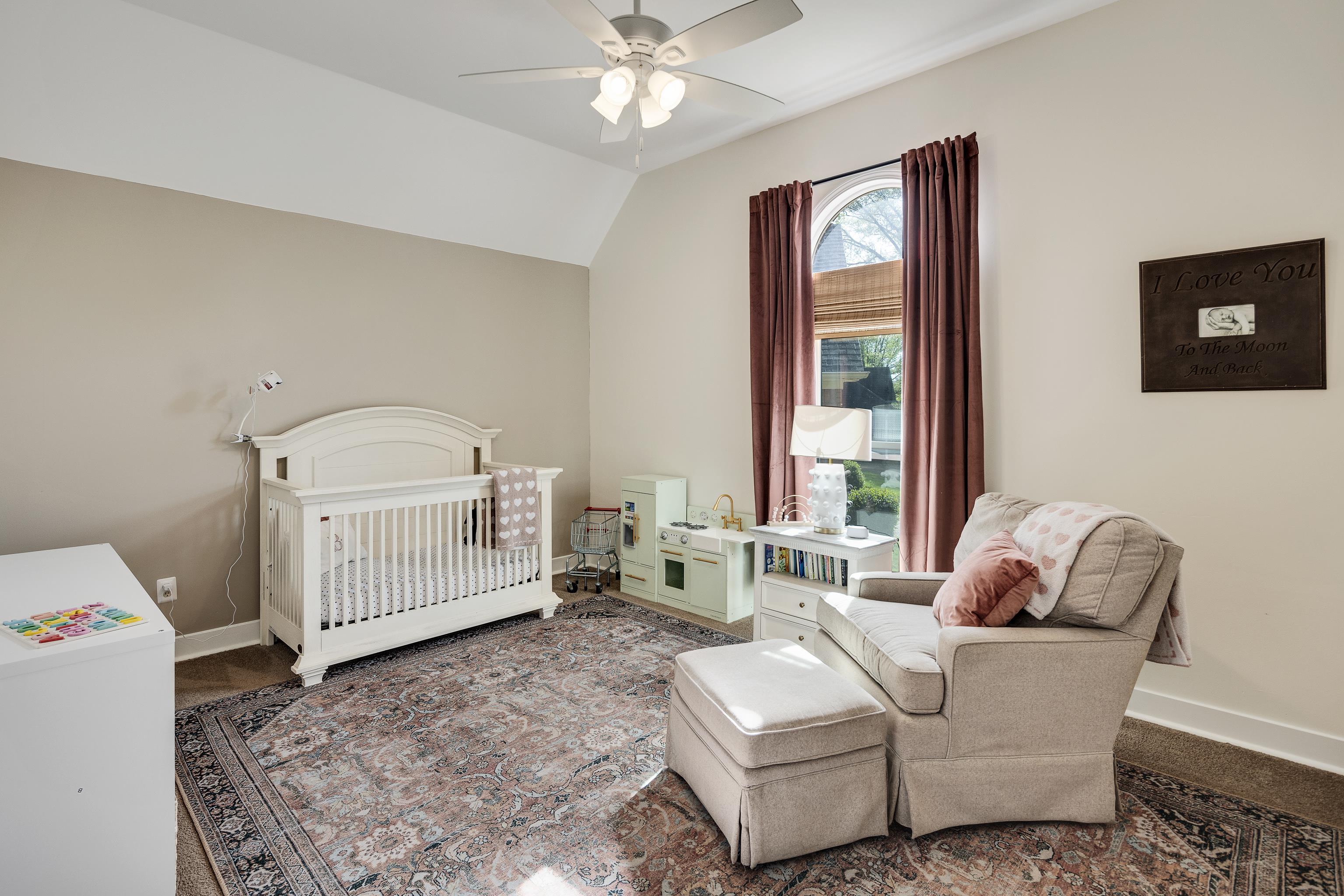 288 Hughes Cove Collierville, TN 38017 - Photo 20 of 31 Bedroom featuring a nursery area, vaulted ceiling, and a ceiling fan