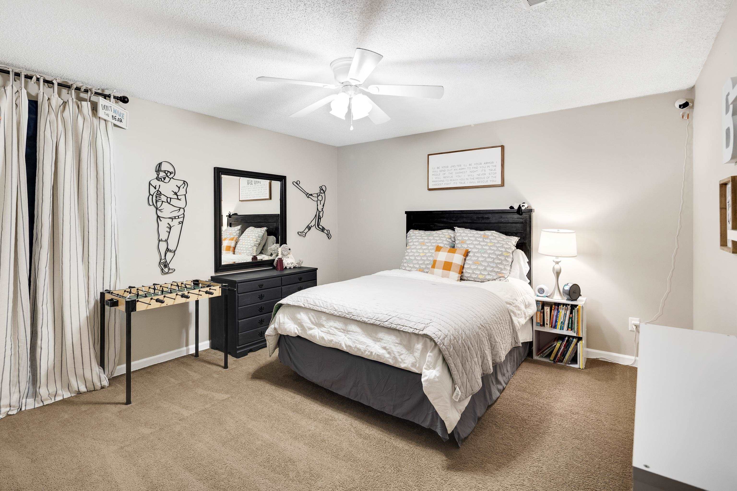 288 Hughes Cove Collierville, TN 38017 - Photo 23 of 31 Carpeted bedroom with a textured ceiling and a ceiling fan