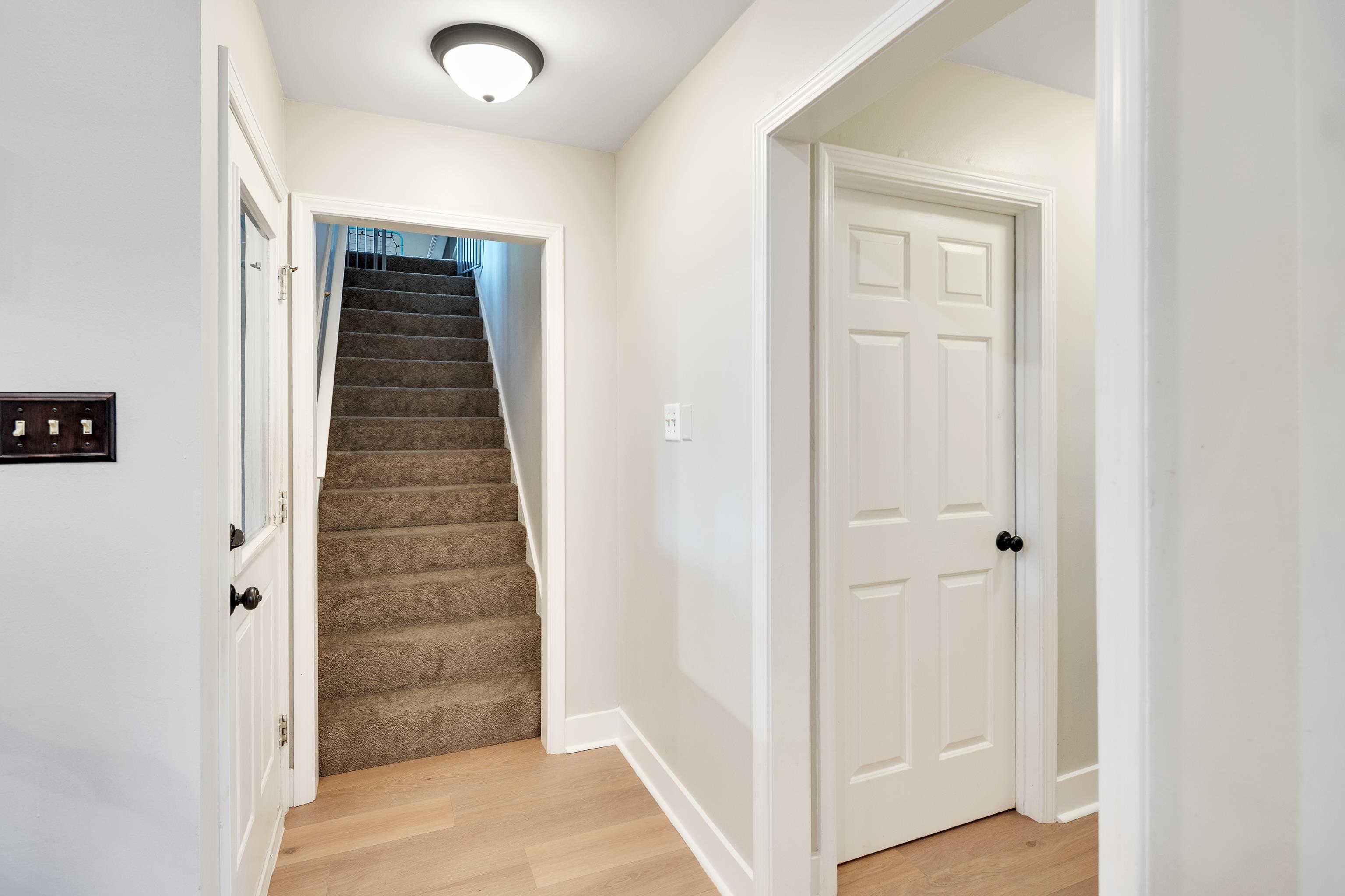 288 Hughes Cove Collierville, TN 38017 - Photo 25 of 31 Stairs with wood finished floors and baseboards