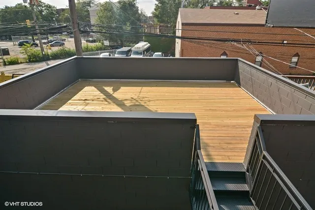 a view of a balcony with city view