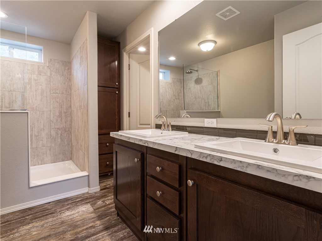 4547 Decatur Drive Ferndale, WA 98248 - Photo 16 of 30 a bathroom with a double vanity sink and a mirror