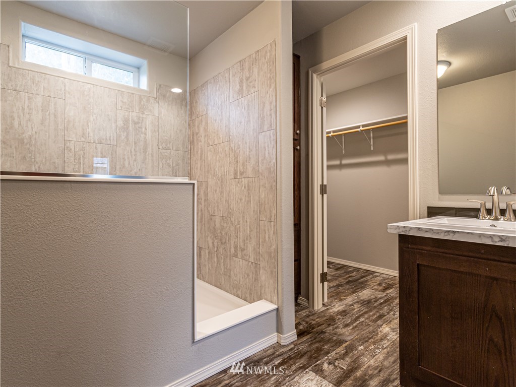 4547 Decatur Drive Ferndale, WA 98248 - Photo 17 of 30 a bathroom with a sink and a mirror