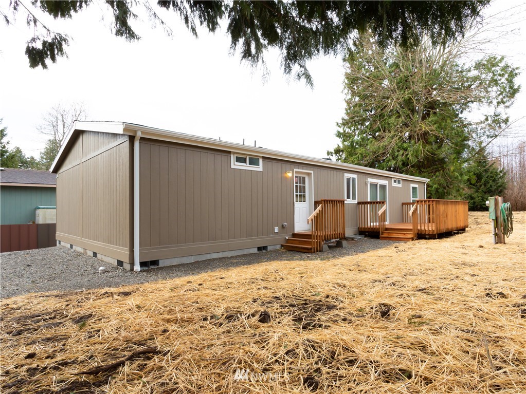 4547 Decatur Drive Ferndale, WA 98248 - Photo 27 of 30 a backyard of a house with garage and barbeque oven