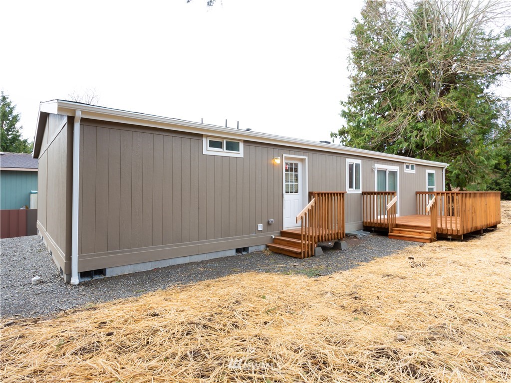 4547 Decatur Drive Ferndale, WA 98248 - Photo 28 of 30 a backyard of a house with barbeque oven and wooden fence