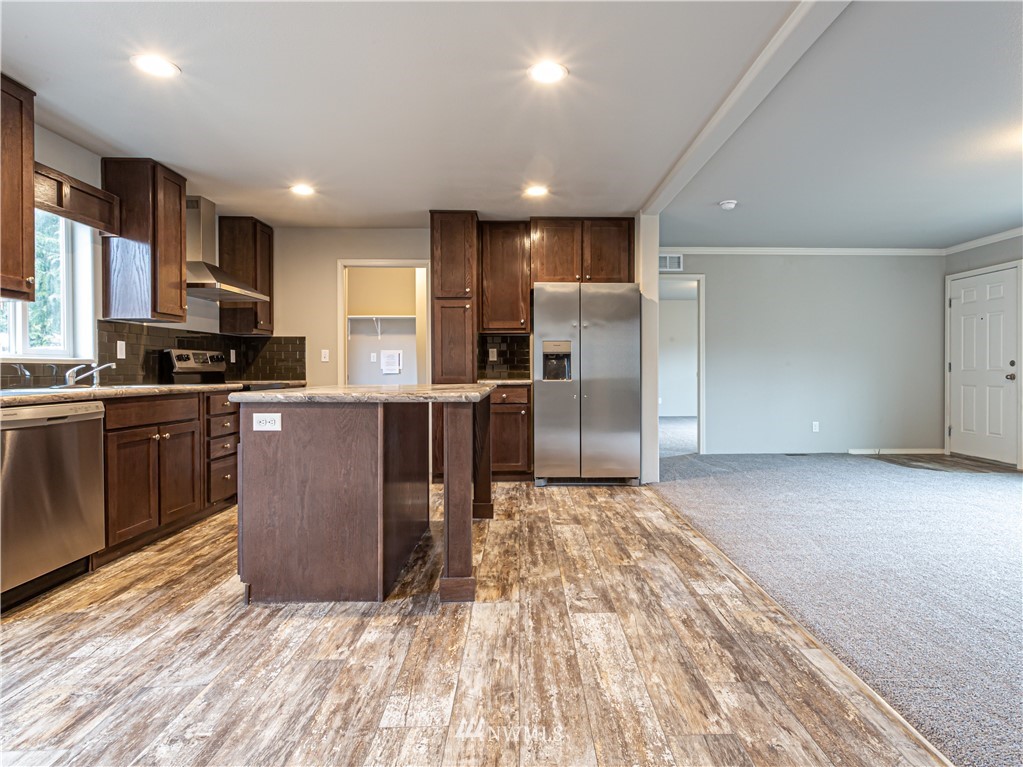 4547 Decatur Drive Ferndale, WA 98248 - Photo 8 of 30 a kitchen with stainless steel appliances granite countertop a refrigerator sink and cabinets