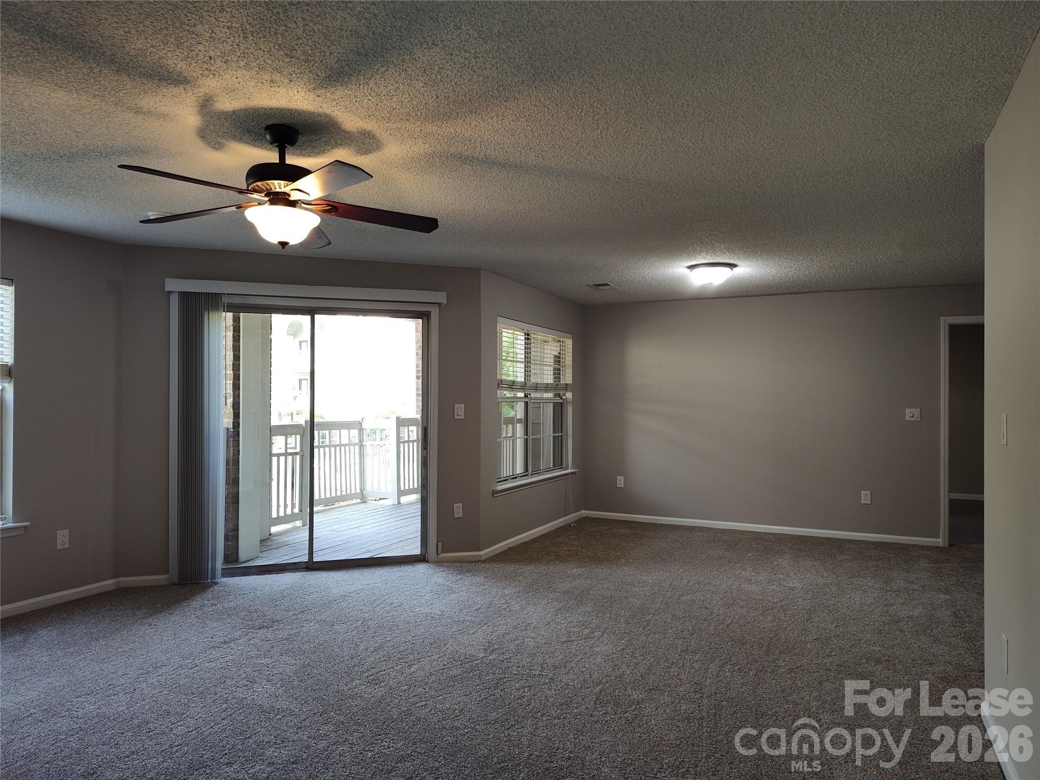 5001 Sharon Road, Unit K Charlotte, NC 28210 - Photo 13 of 24 a view of an empty room with a window