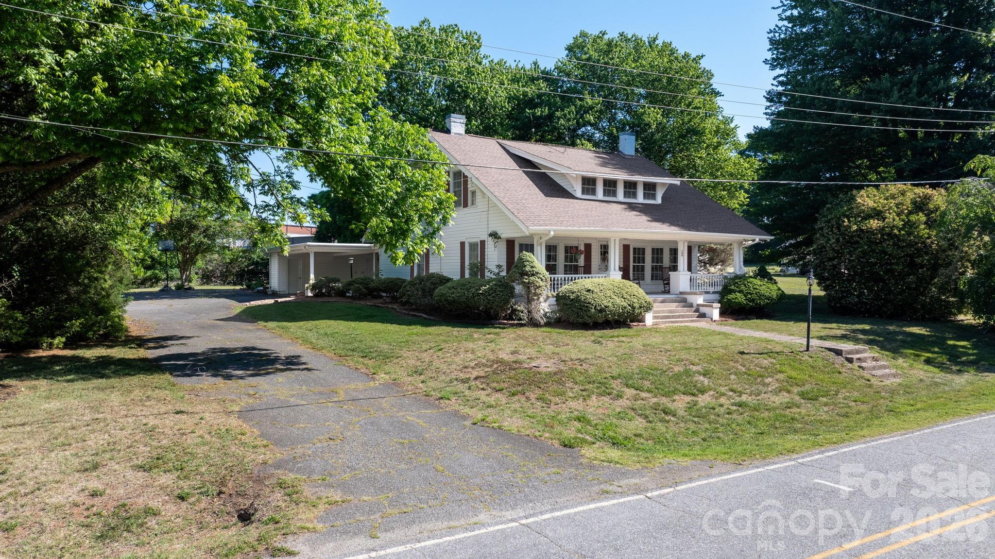 144 Hunter Bridge Road Stony Point, NC 28678 - Photo 28 of 45 a front view of a house with a yard and trees